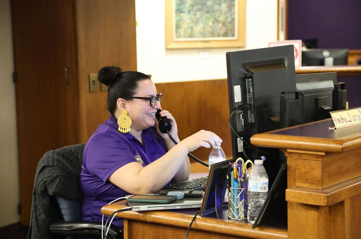 A member of the HelpDesk talks on the phone